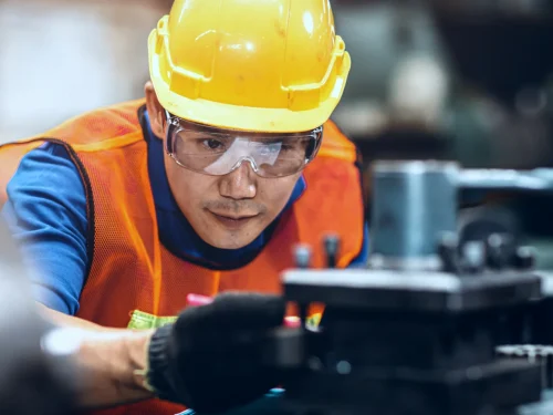 factory operator checking equipment